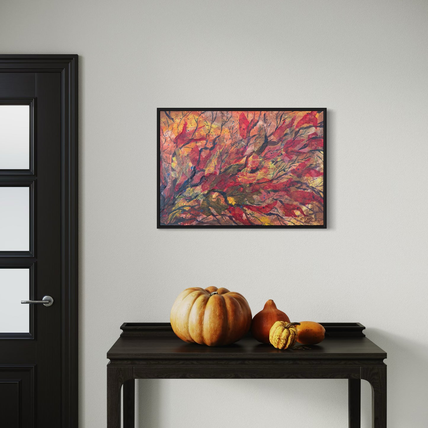 Framed abstract collage painting with vibrant red orange and yellow resembling an autumn tree.