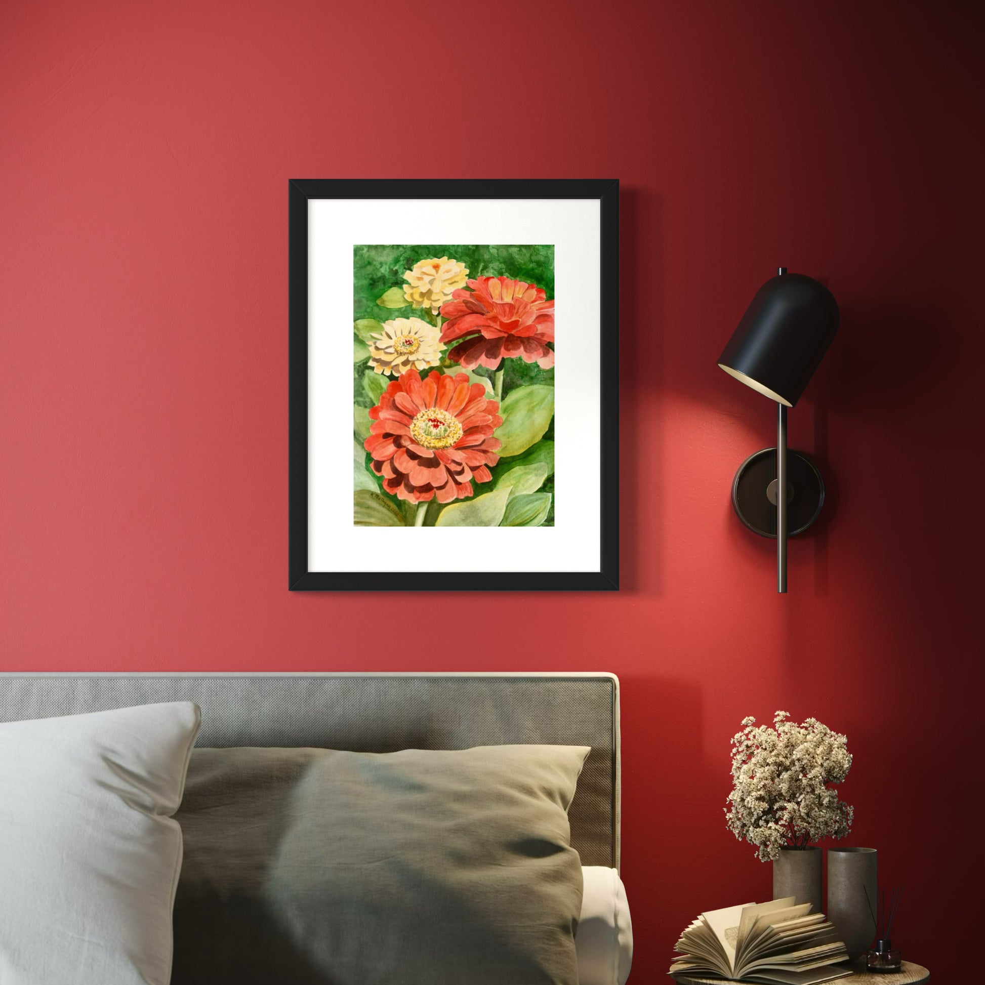 Framed watercolor painting of yellow and red zinnia flowers with green leaves.