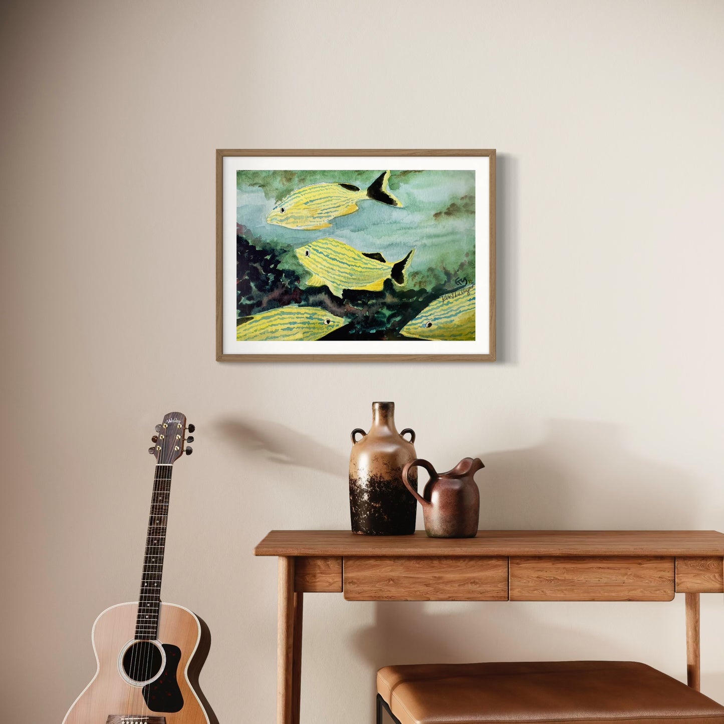 Framed watercolor artwork of yellow tropical fish.