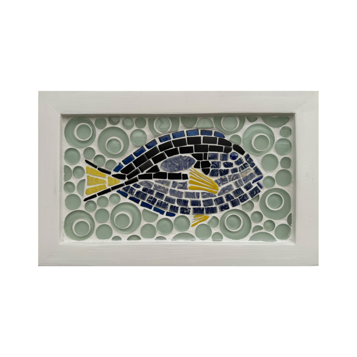 Framed mosaic artwork of a fish with a circular pattern on a white background