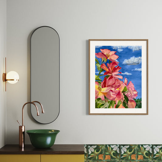 Framed artwork of pink roses against a blue sky.