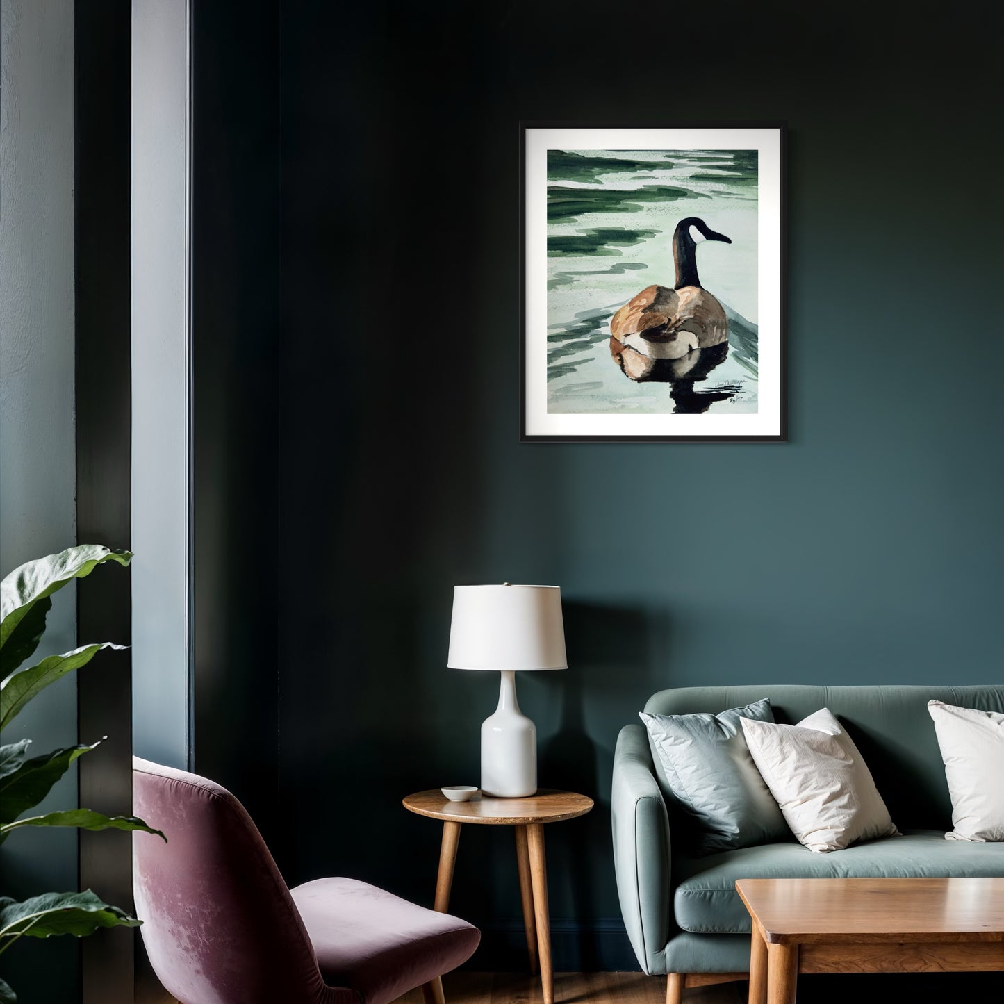 framed watercolor art of Canada goose swimming on green water