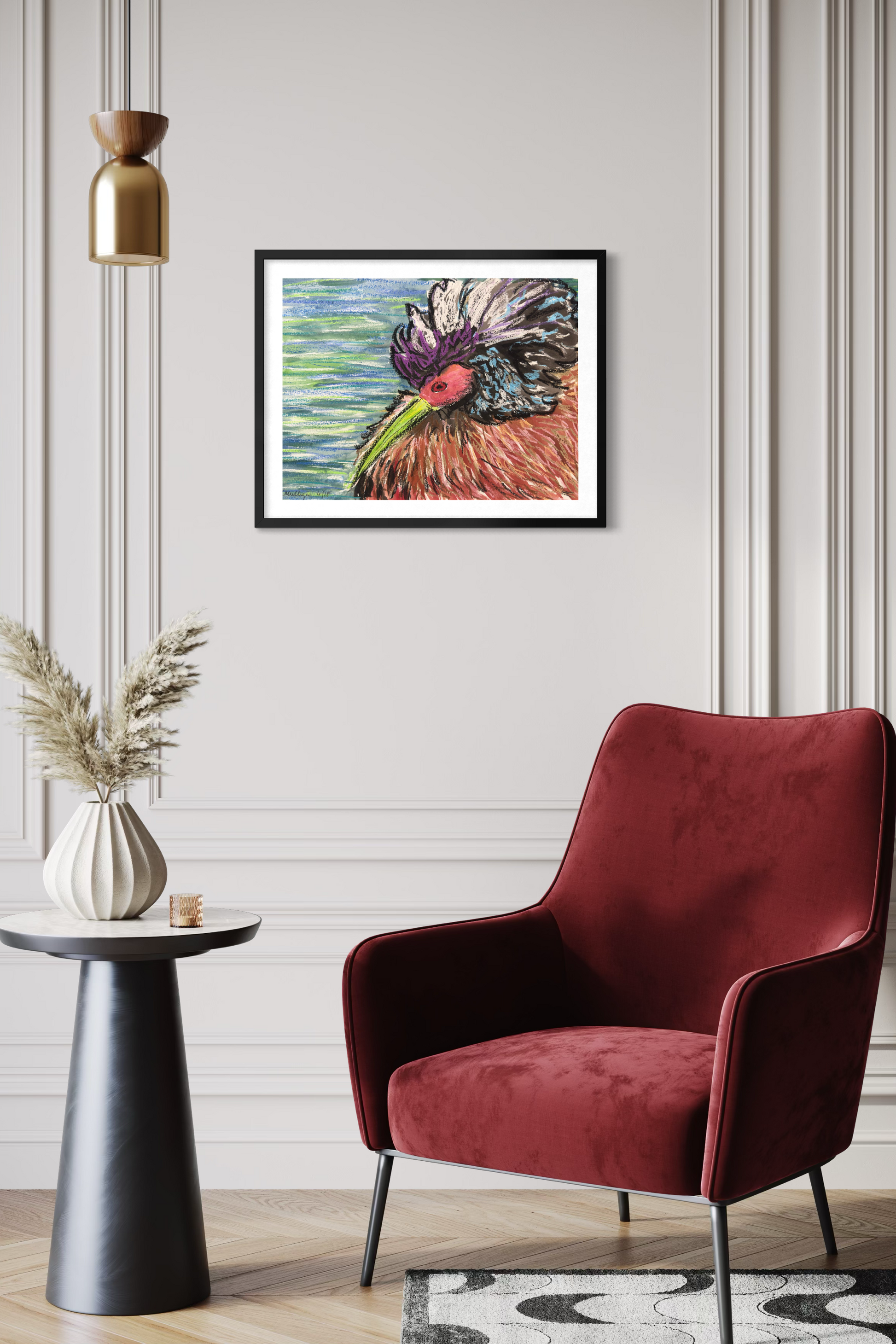 Framed colorful bird abstract artwork above a red armchair in a room with decorative elements.