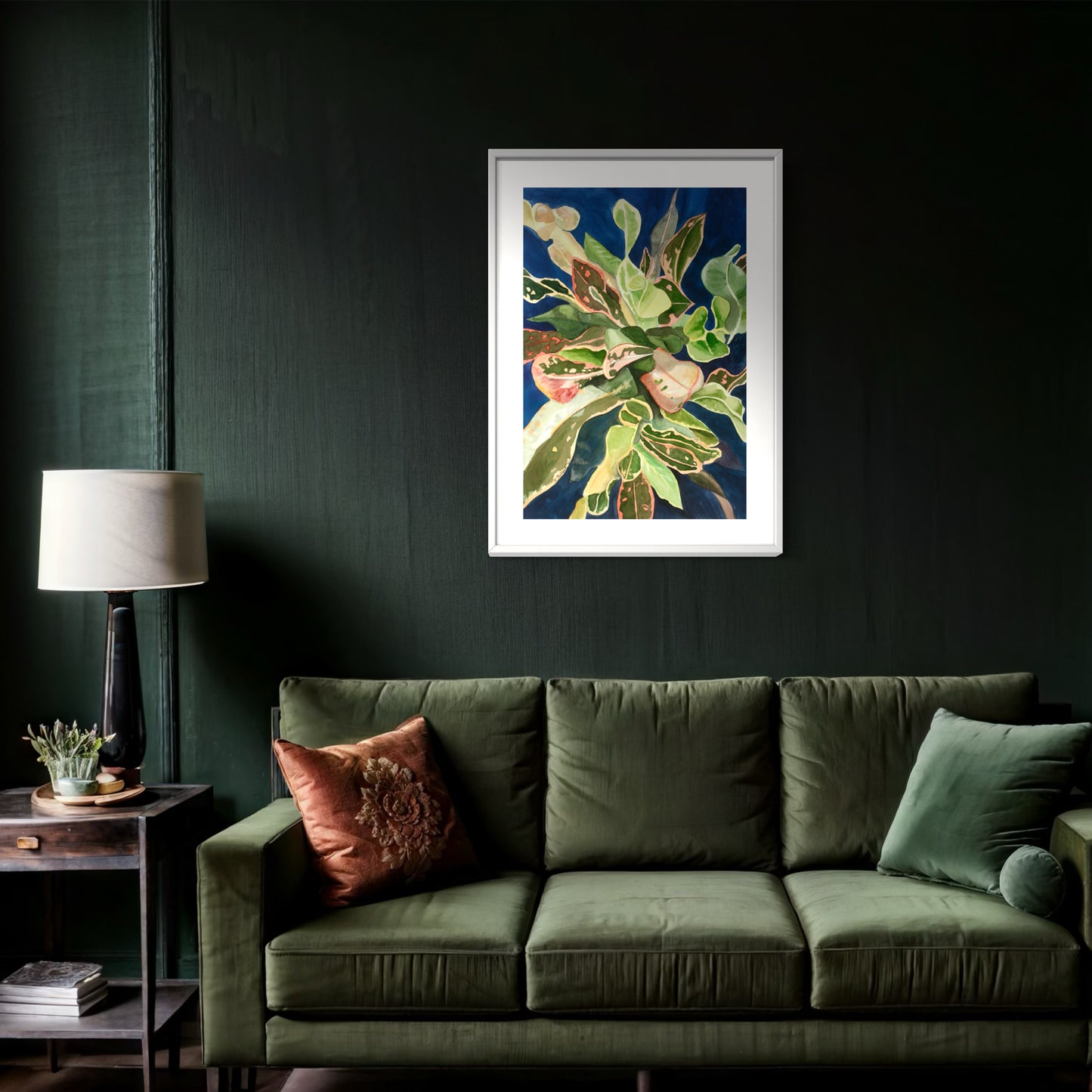 Framed watercolor painting of a colorful tropical croton plant.
