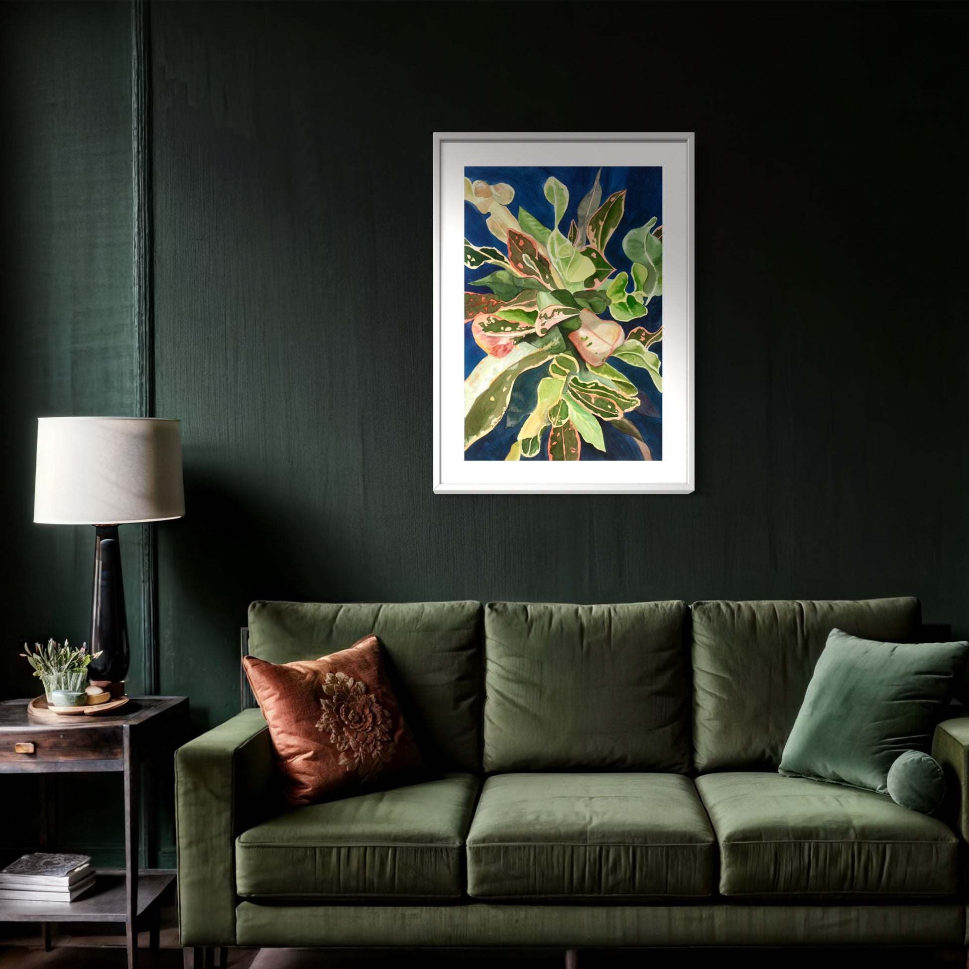 Framed watercolor painting of a colorful tropical croton plant.