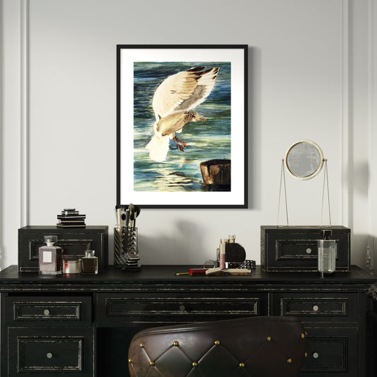 Framed watercolor artwork of a seagull bird landing on a pier over water.