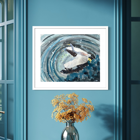 Framed watercolor artwork of a great blue heron in flight bird over water.