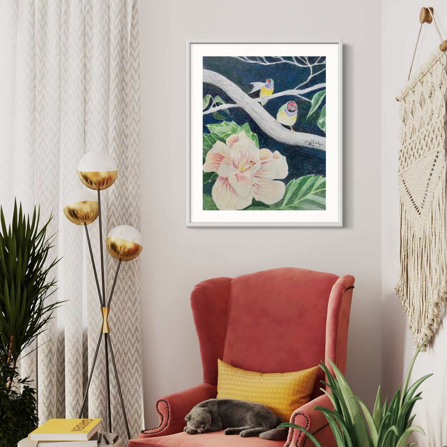 Framed artwork with birds on a branch and hibiscus flowers.