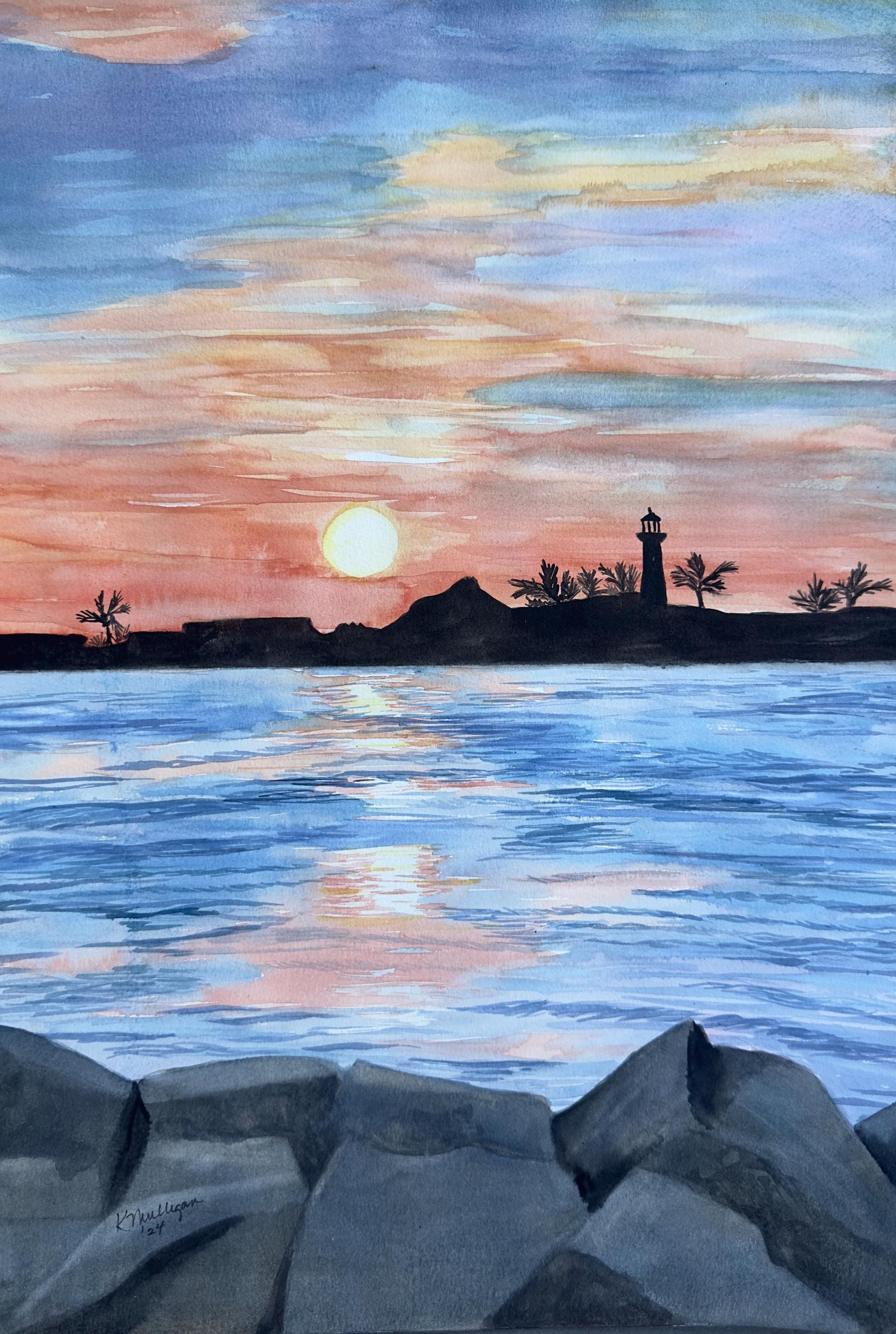 Watercolor painting of a lighthouse silhouetted against  a sunset sky over water and rocks.