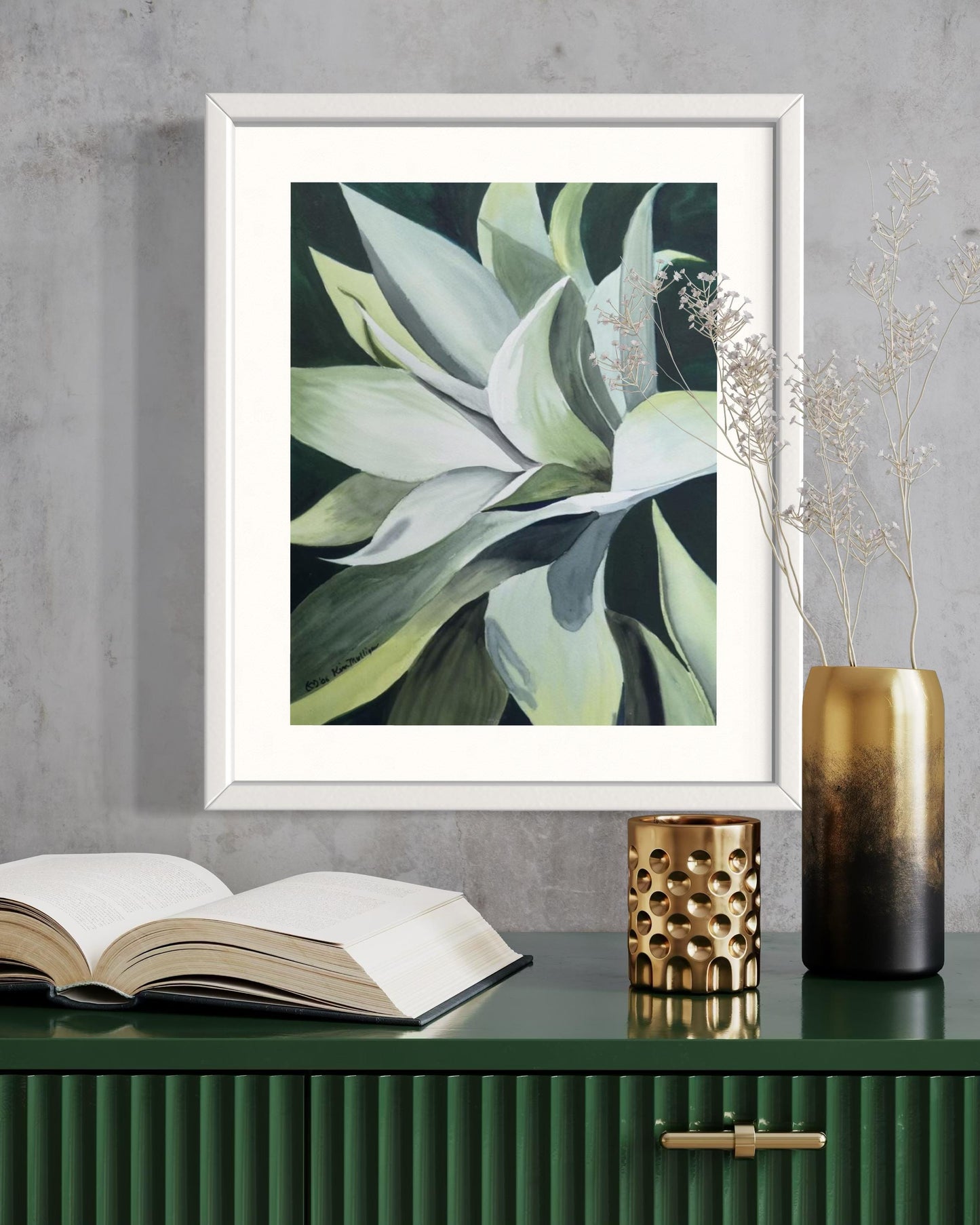 Framed watercolor painting of an green agave plant with dark background.