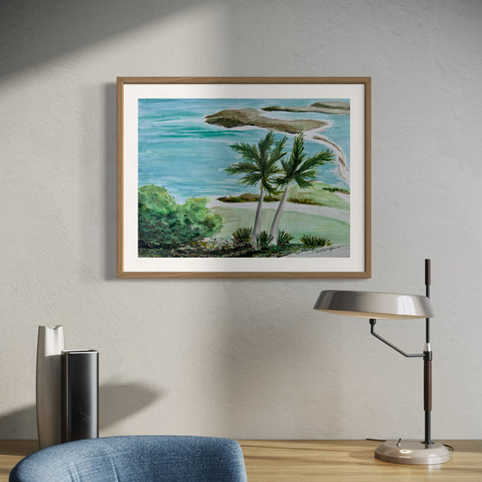 Framed painting of a tropical landscape with palm trees and a body of water.