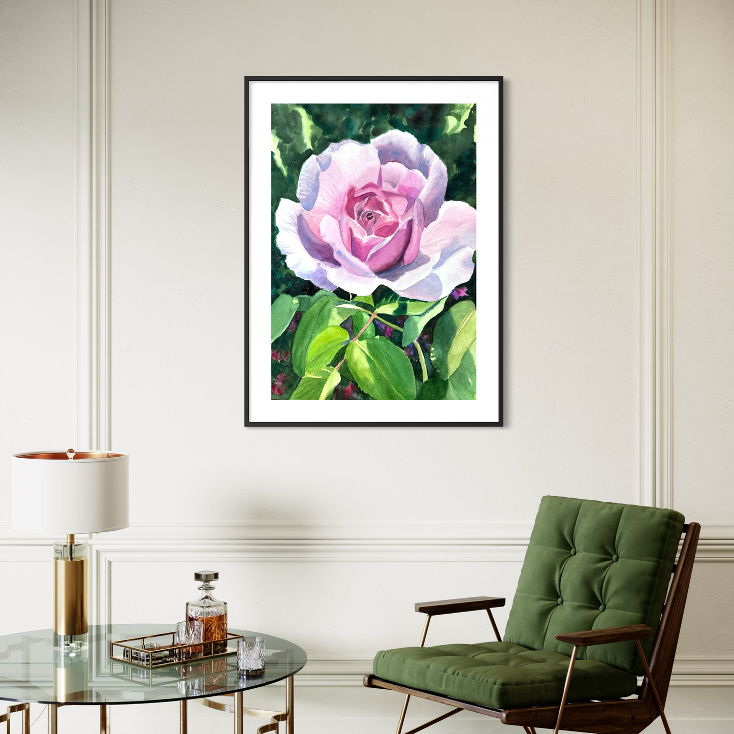 Framed watercolor artwork of a pink rose on a wall above a green chair and glass table.