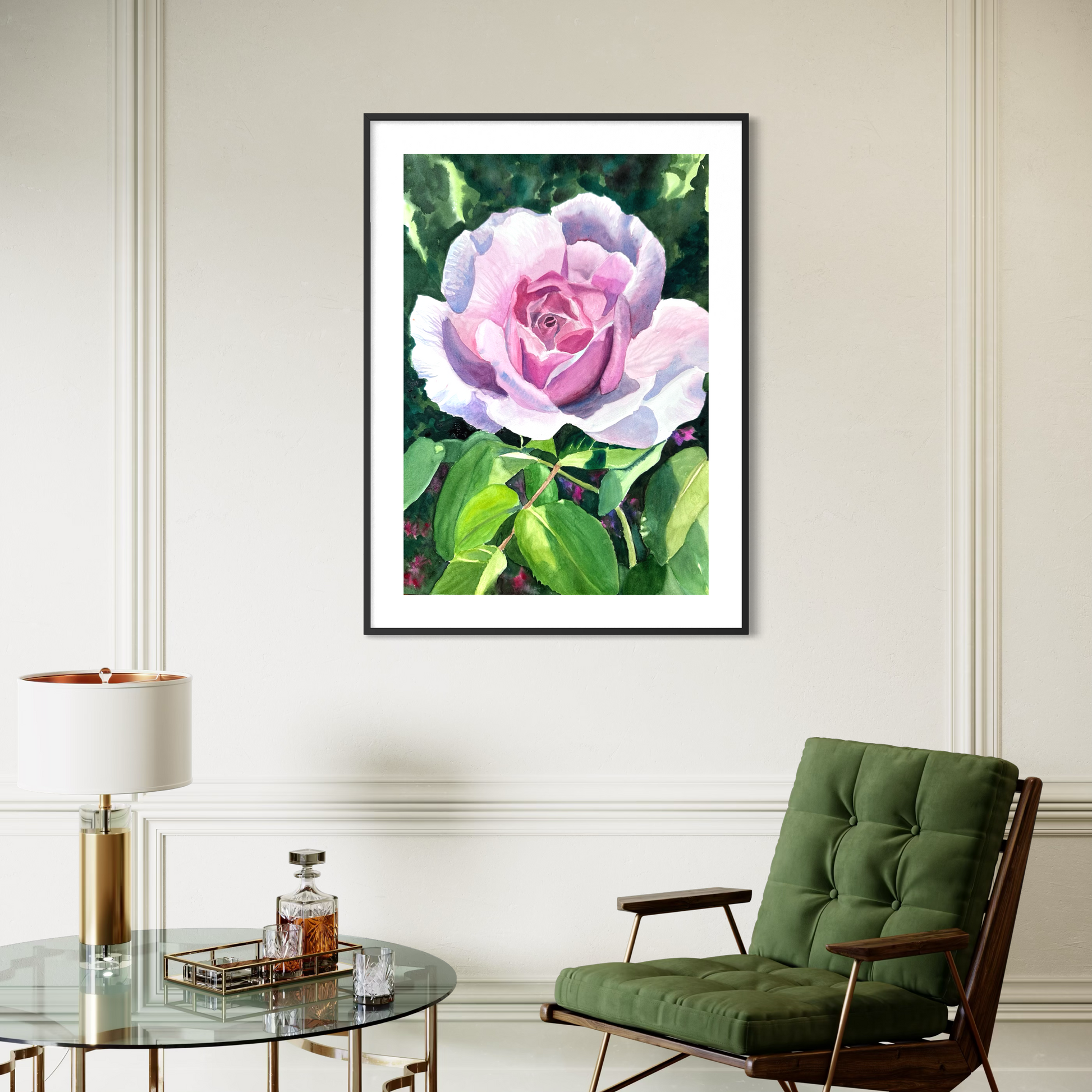 Framed watercolor artwork of a pink rose on a wall above a green chair and glass table.