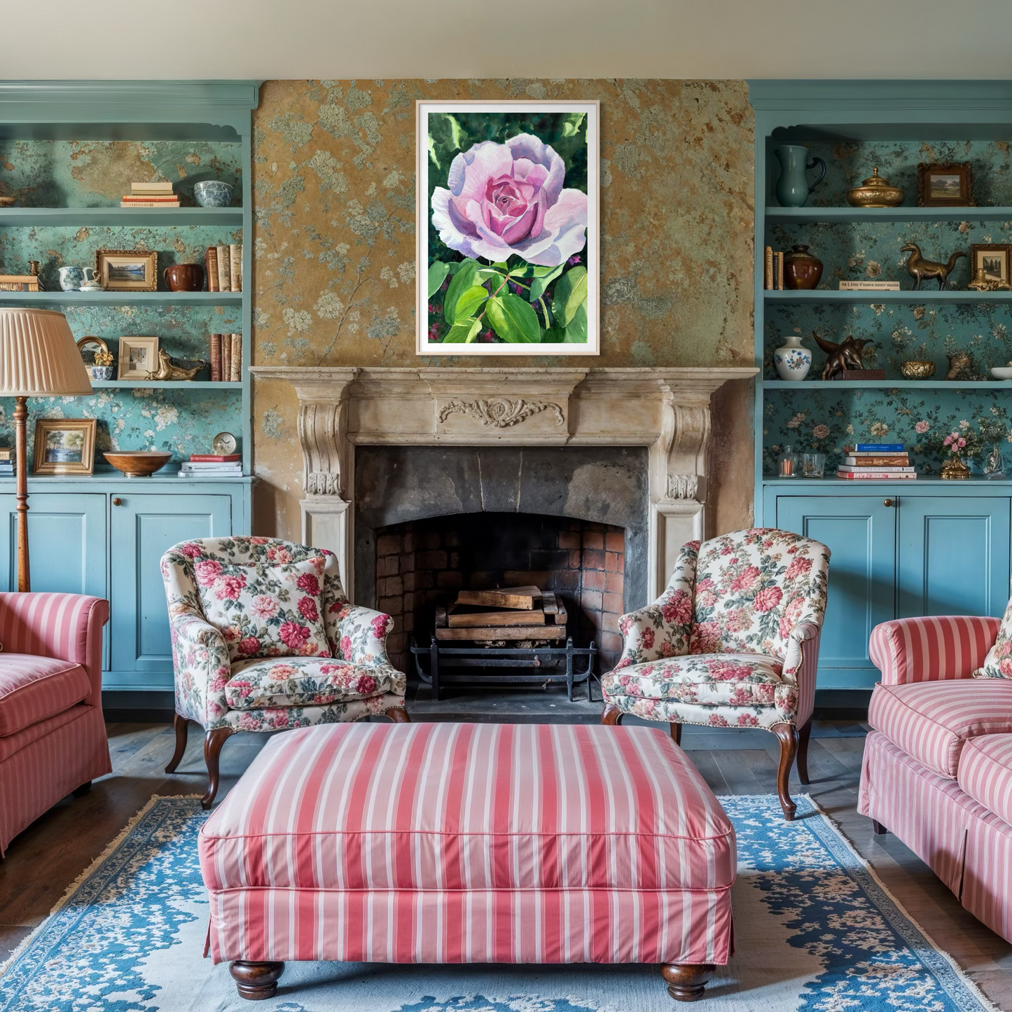 Living room with floral armchairs, striped ottoman, and a framed pink rose painting above a fireplace.
