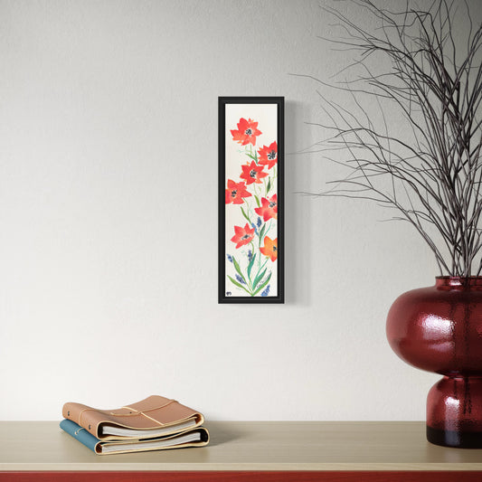Framed floral artwork with abstract poppies on a wall above a shelf with books and a vase.