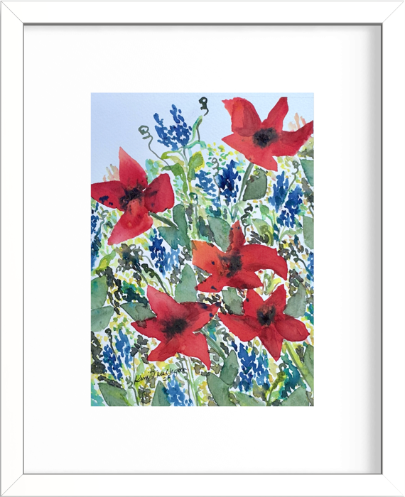 Framed watercolor floral art painting featuring red poppies and blue flowers with green leaves on a white mat and white frame.