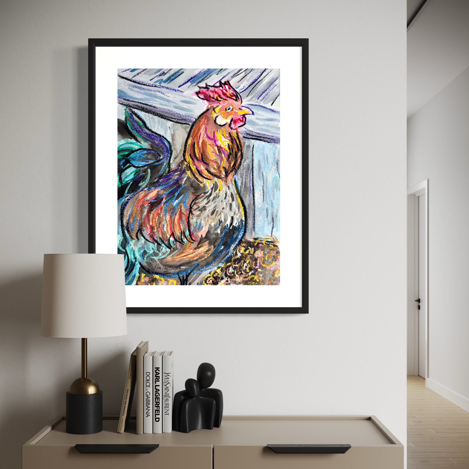 Framed Colorful rooster abstract painting on a wall above a white console table with decor items.