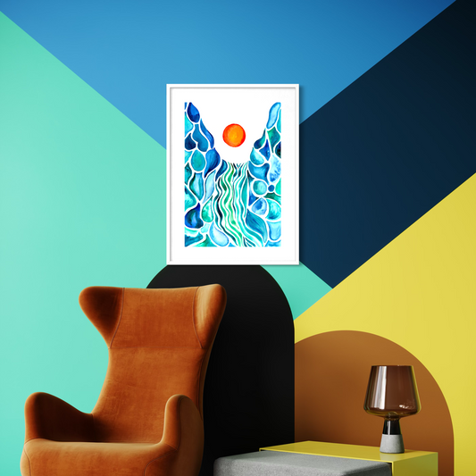 A framed abstract art print featuring blue and teal wavy patterns with a small orange sun, displayed on a geometrically styled wall above an orange armchair and next to a yellow side table with a lamp.