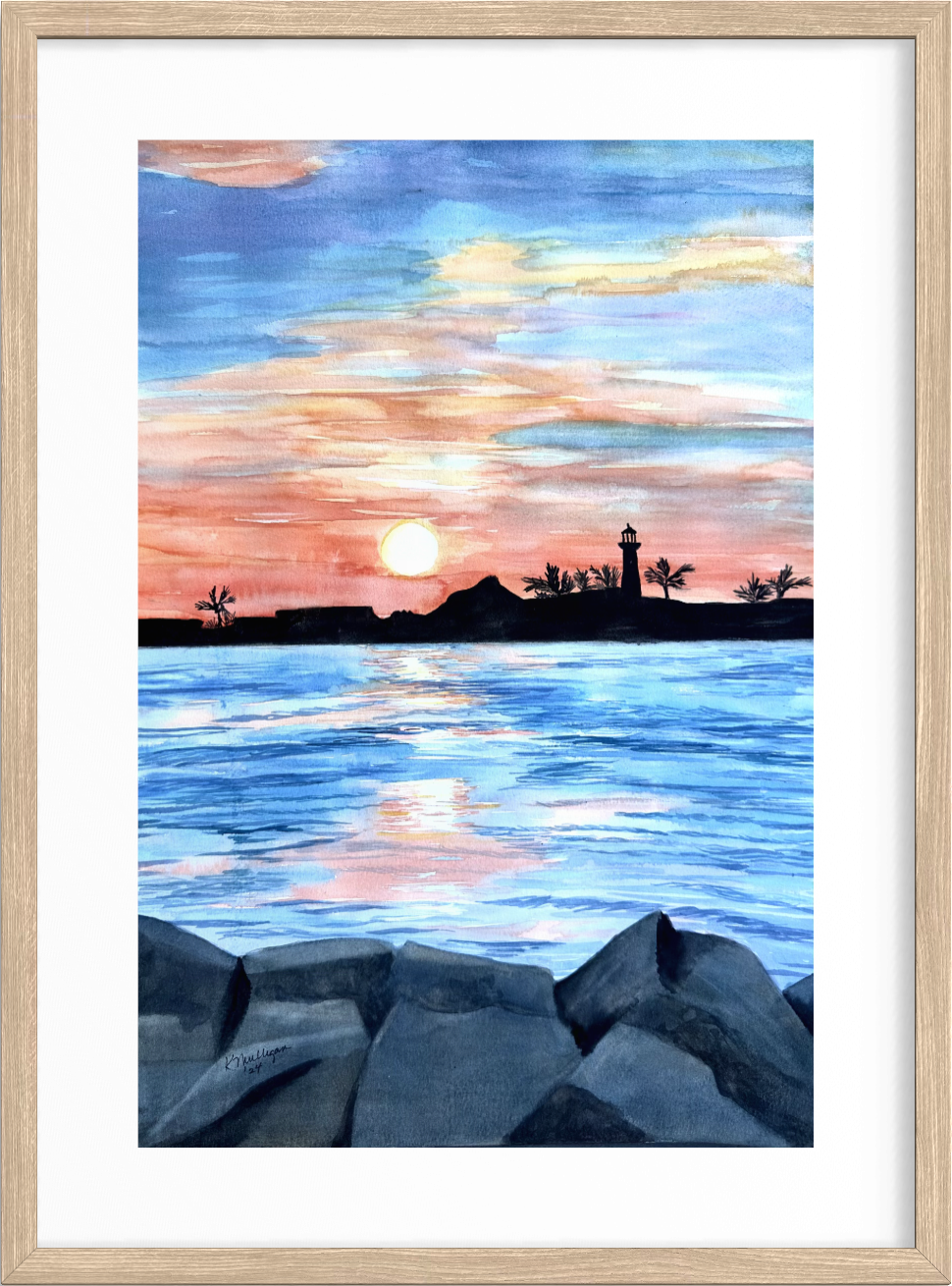 Framed watercolor artwork of a sunset over water with a lighthouse and palm trees.