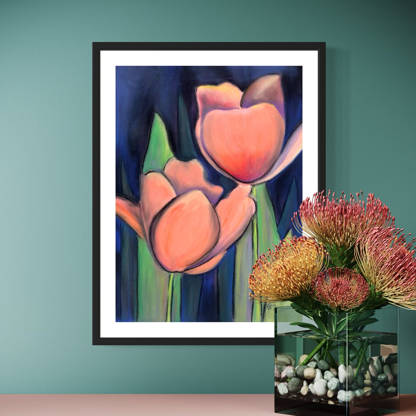 Framed mixed media artwork of pink tulips on a teal wall with a vase of flowers below.