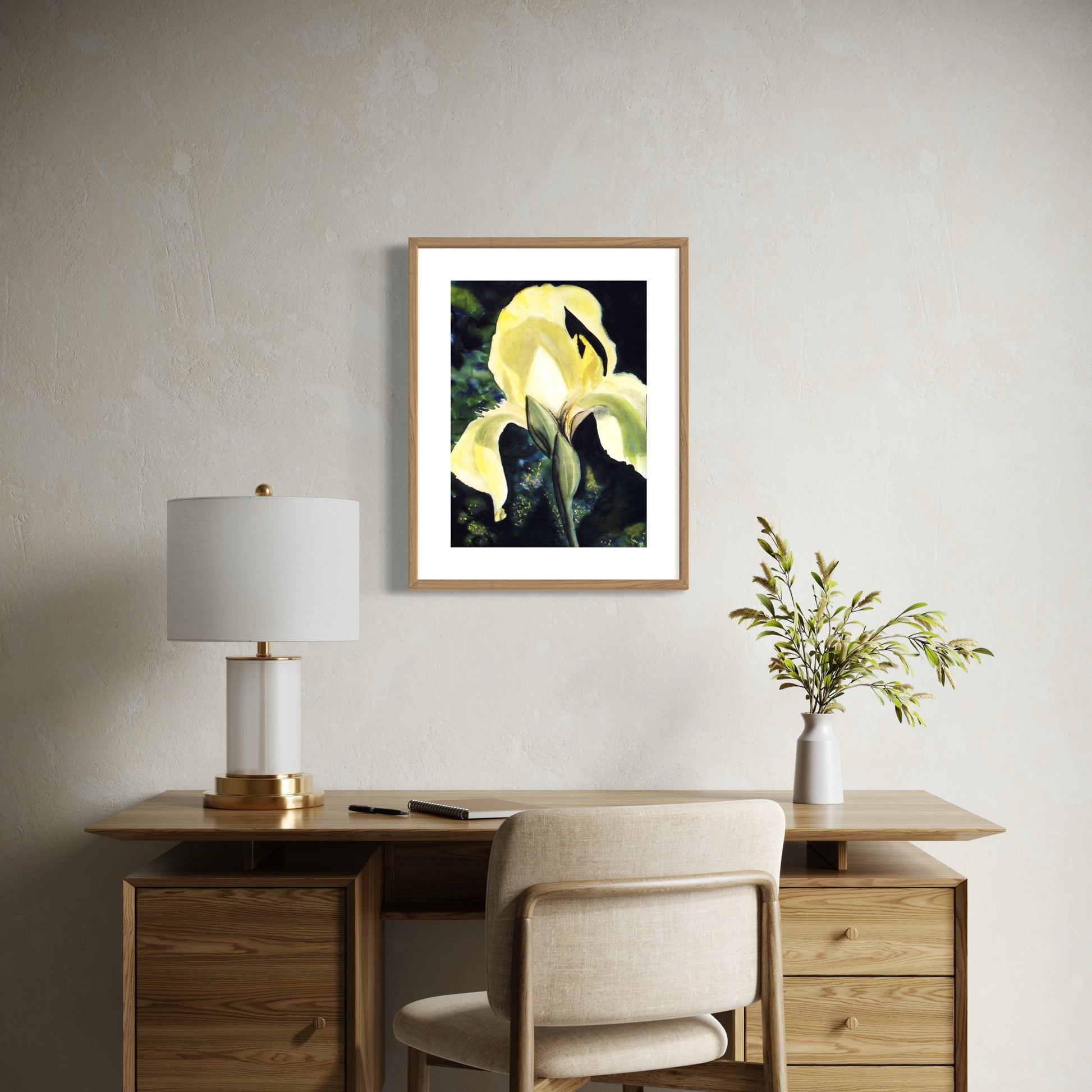 Framed watercolor painting of a yellow iris flower.